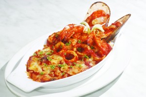 The asam pedas seafood baked rice has New Zealand mussels, prawn and squid in a sour and mildly spicy tamarind sauce.